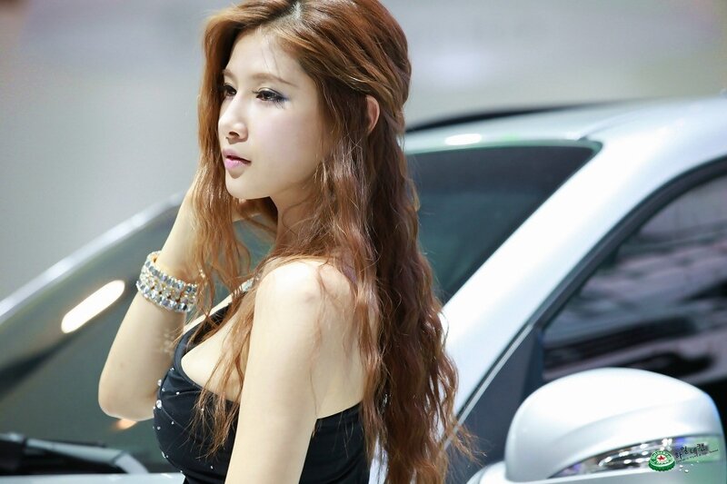 woman posing at car show