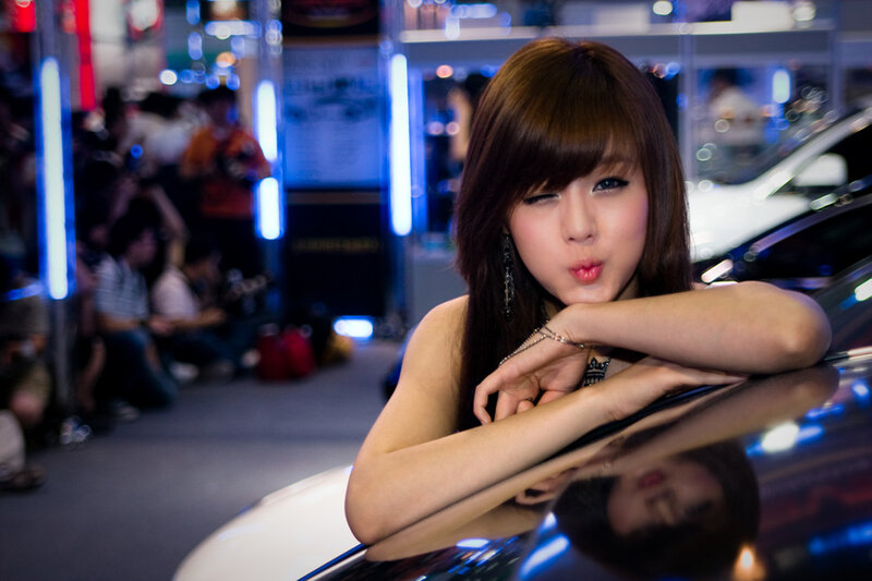 woman posing at car show