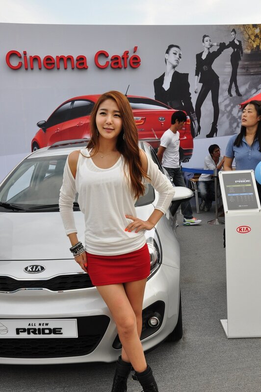 Woman posing at Kia car event