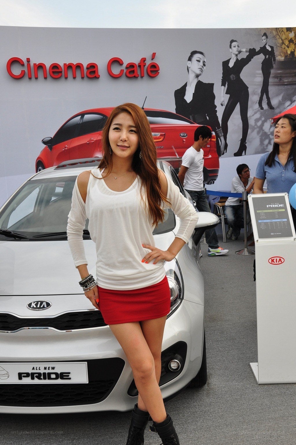 Woman posing at Kia car event