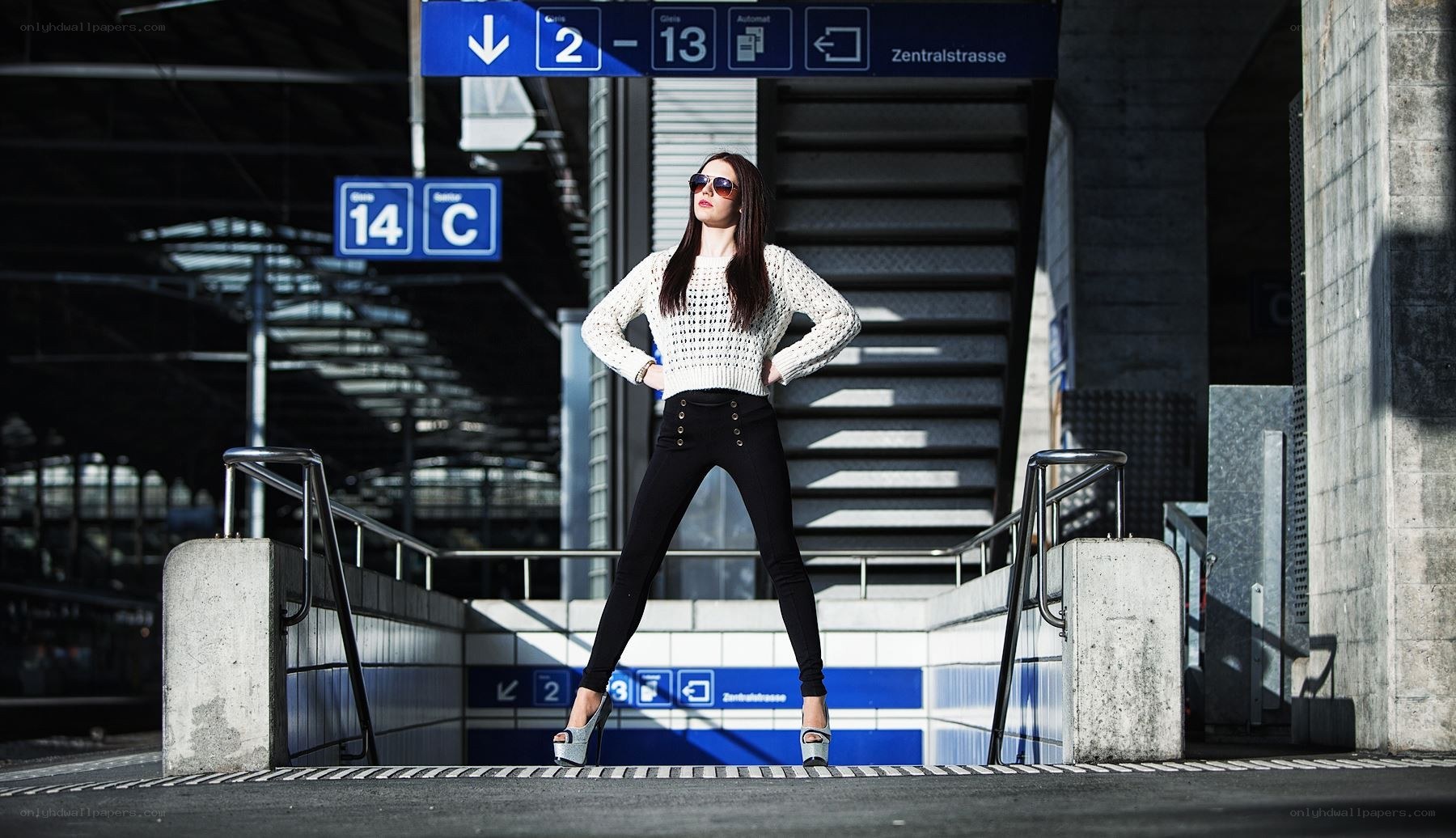 Woman posing at train station