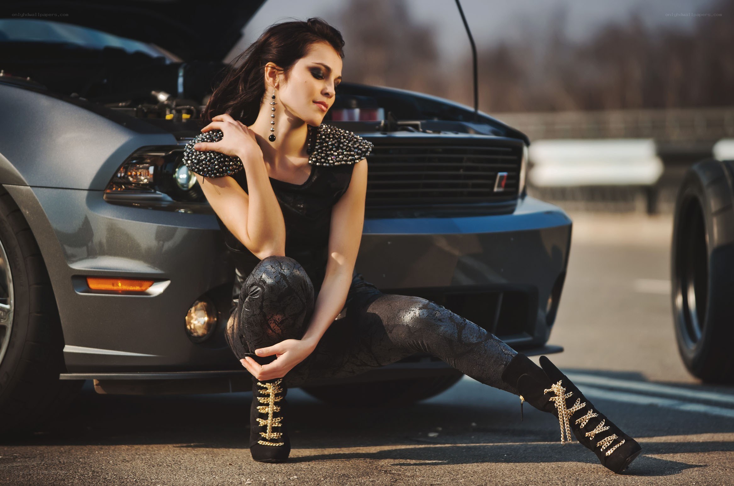 woman posing by car