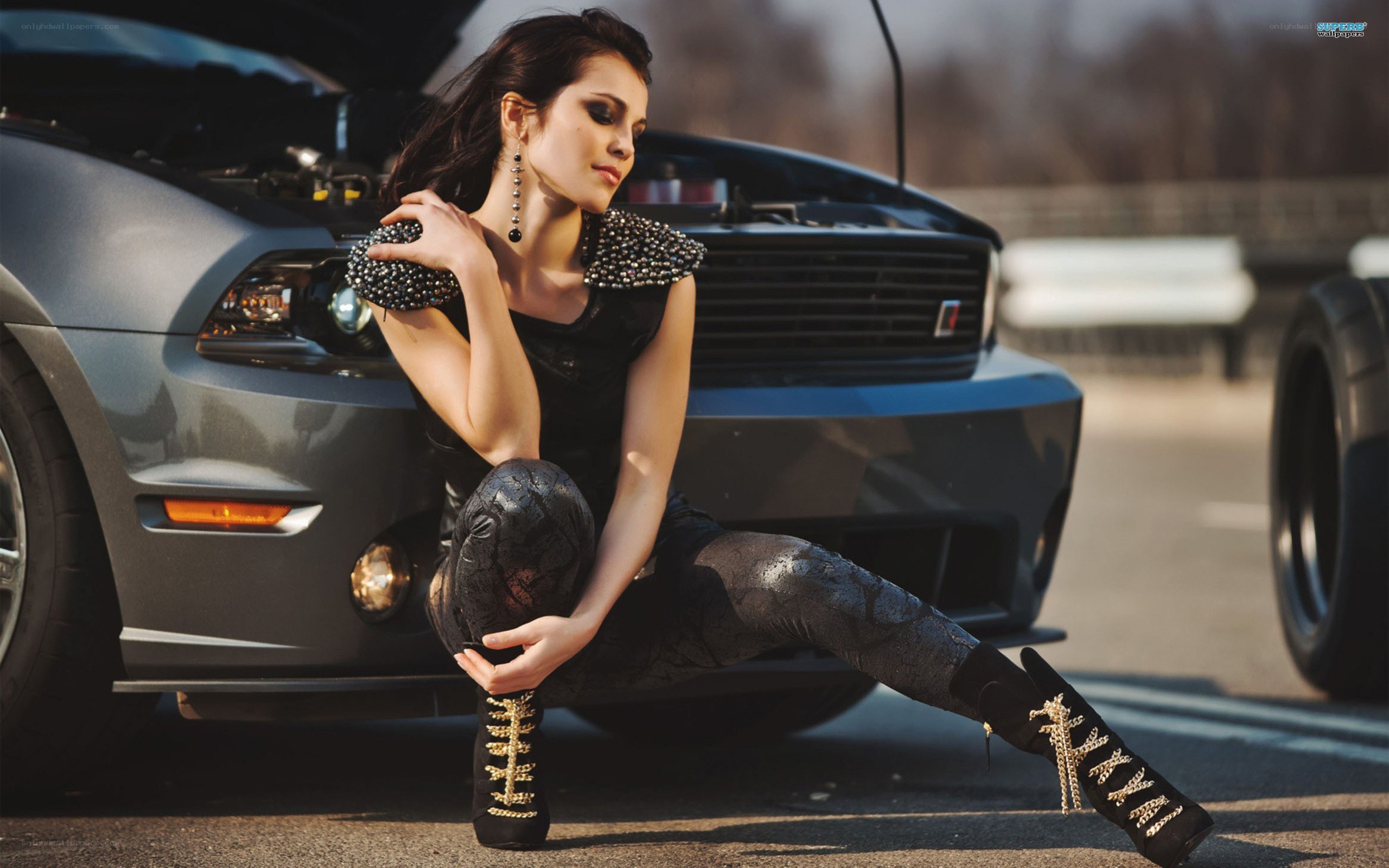 woman posing by car