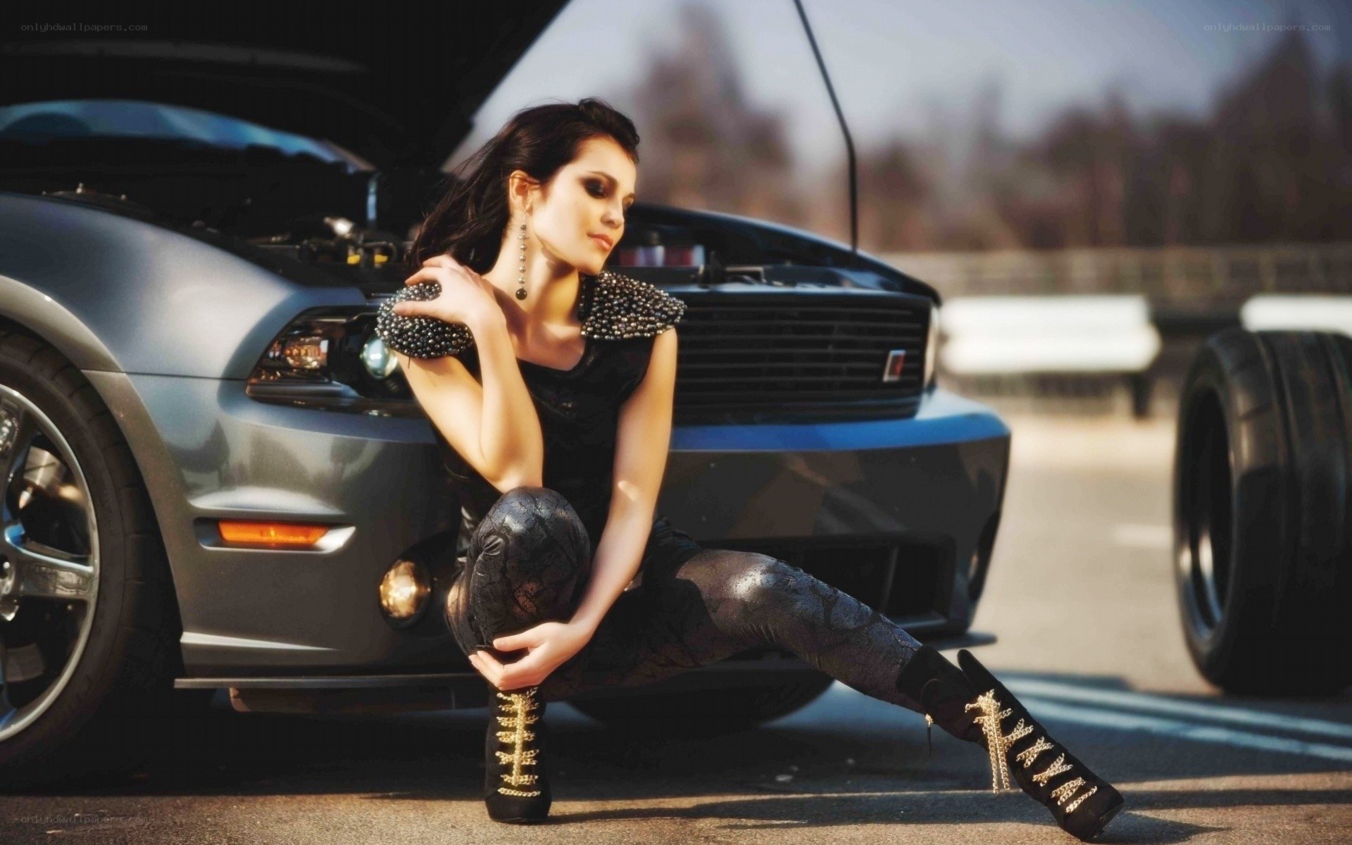 woman posing by car
