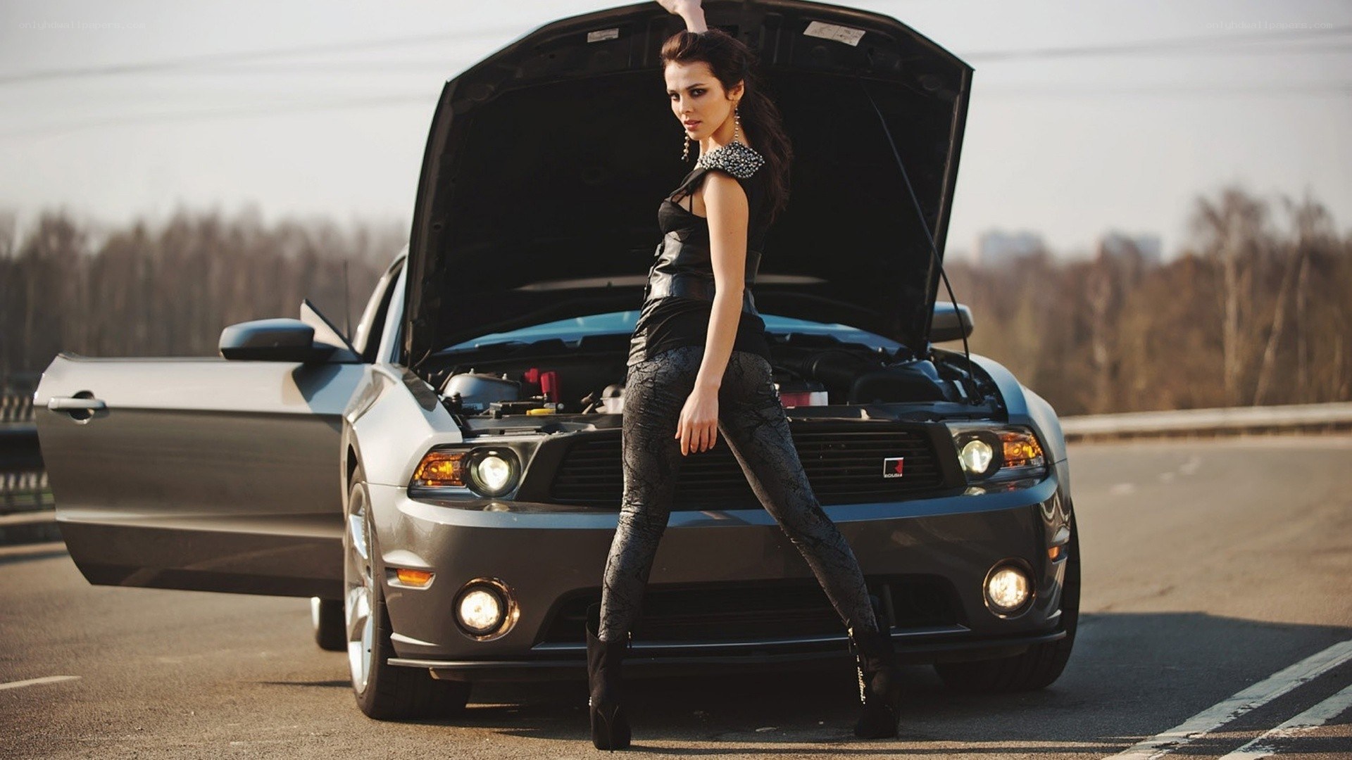 woman posing by car
