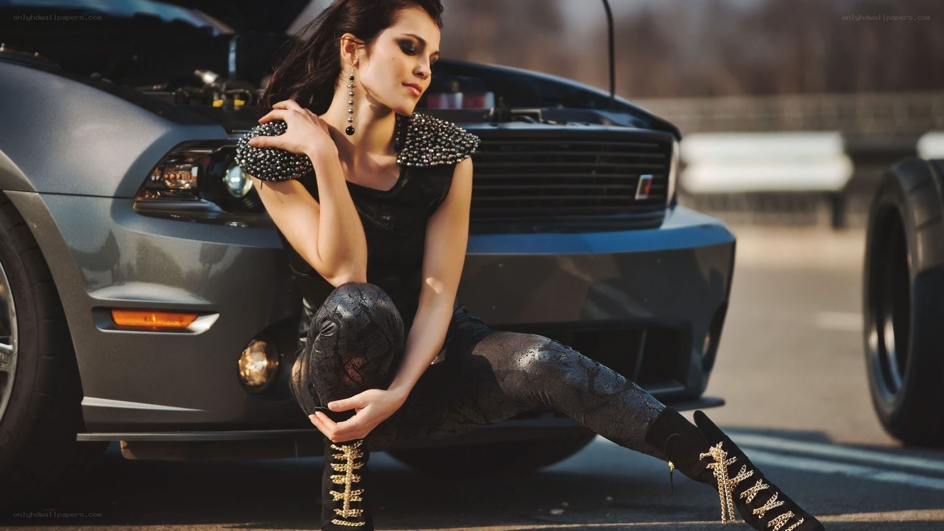 woman posing by car