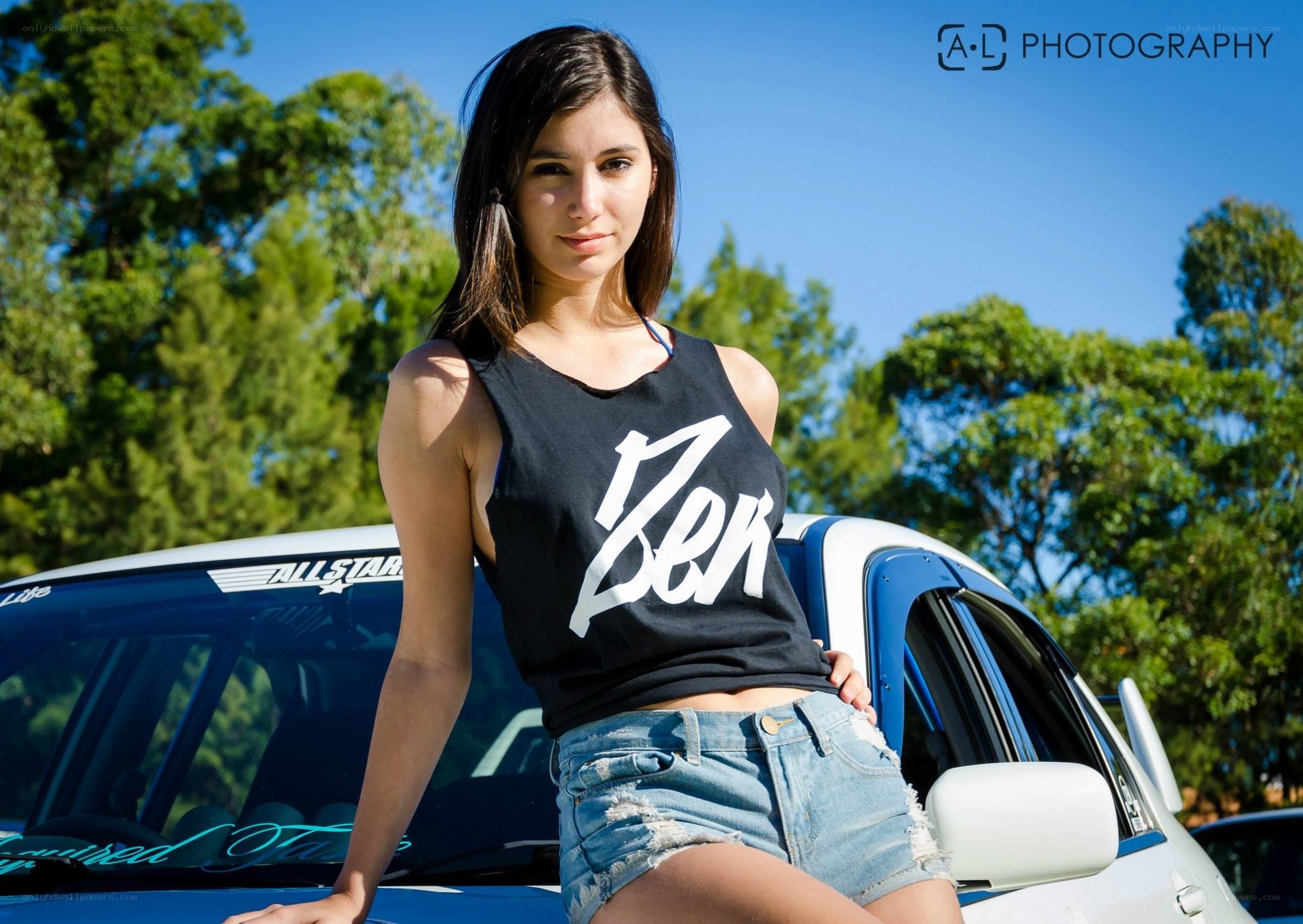 woman posing by car