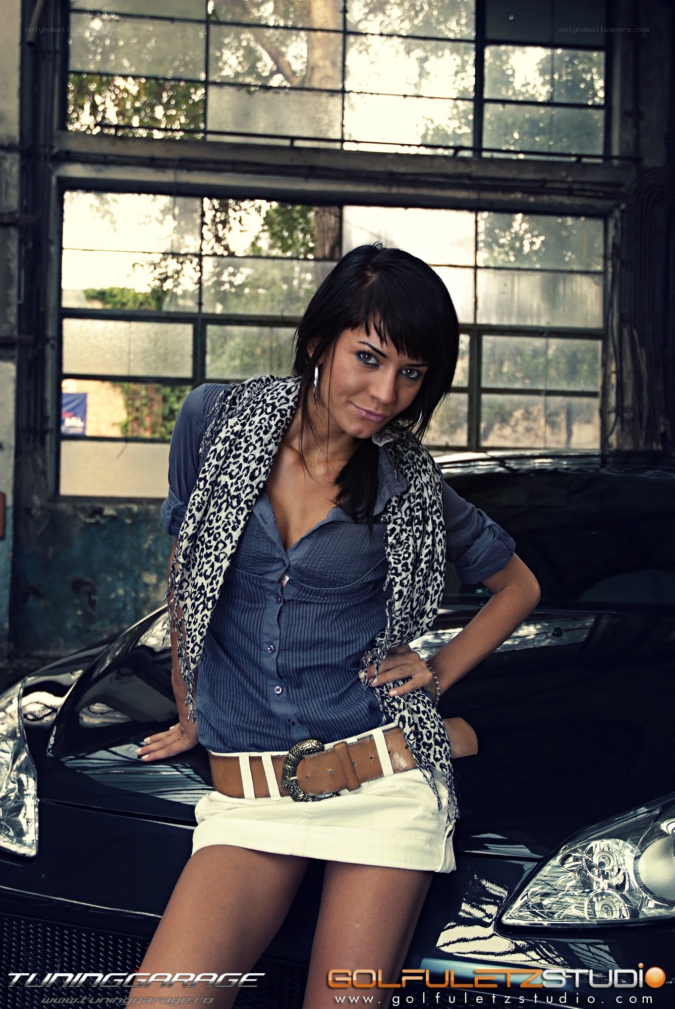 woman posing by car