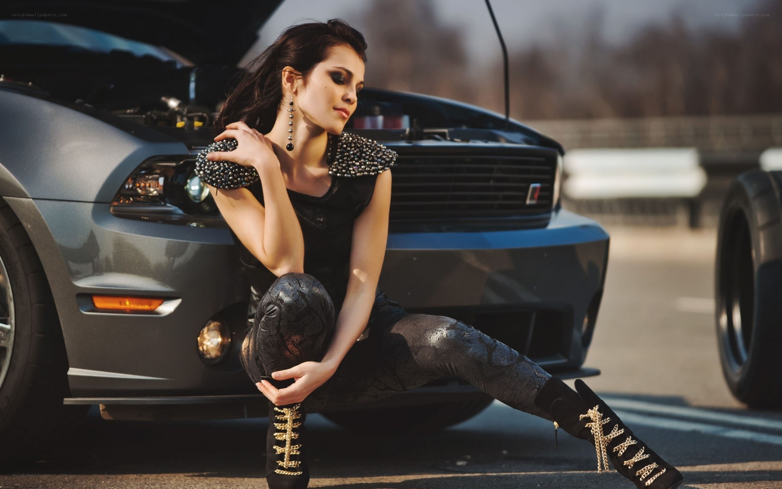 woman posing by car