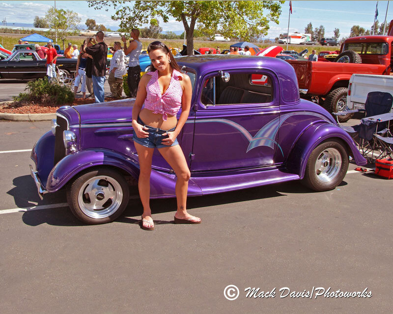 Woman Posing by Purple Car
