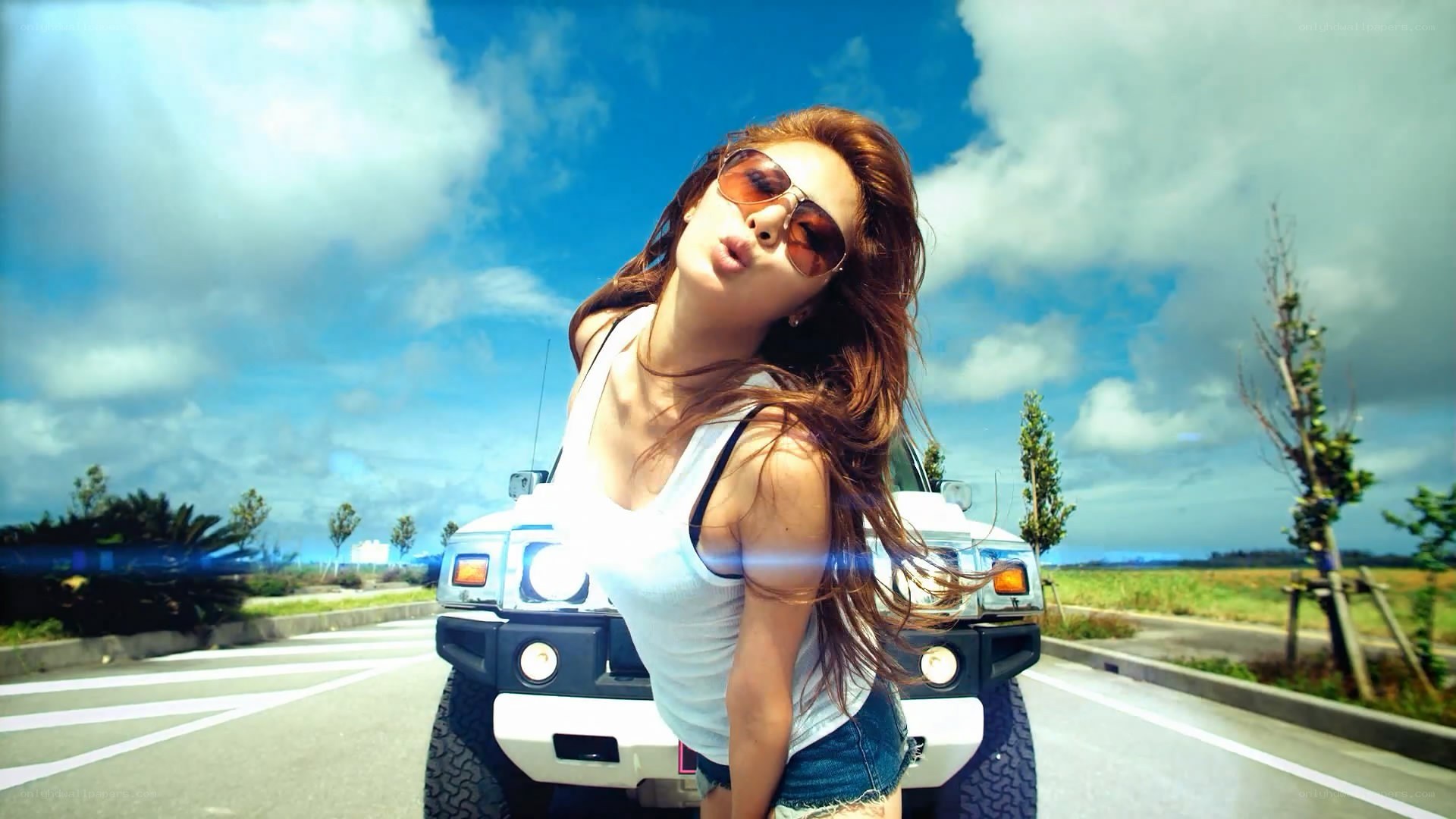 woman posing by white car