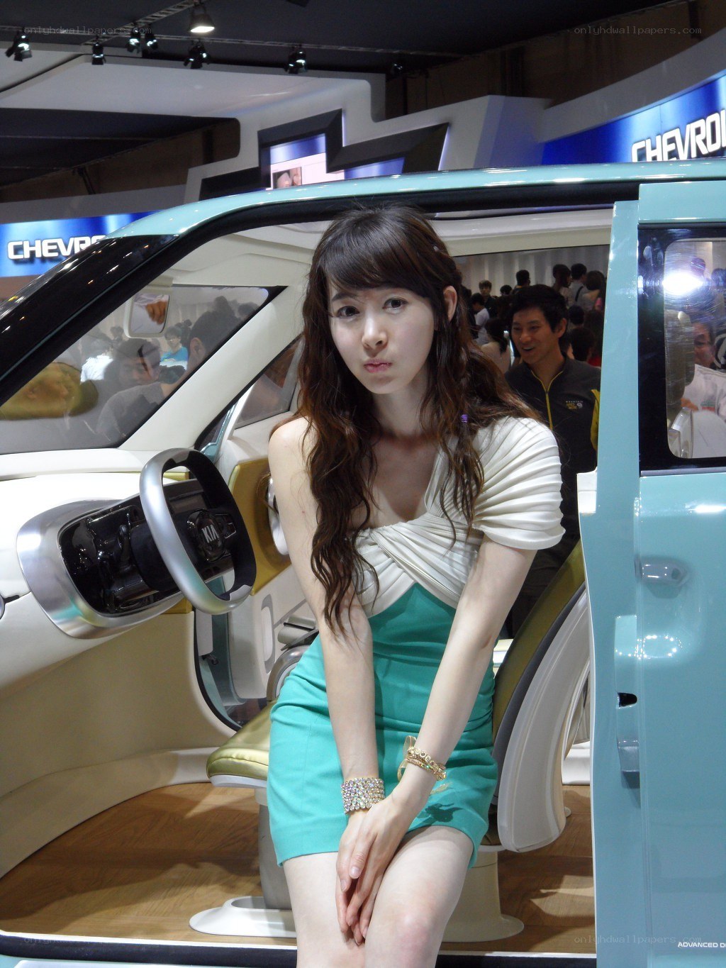 Woman posing in concept car
