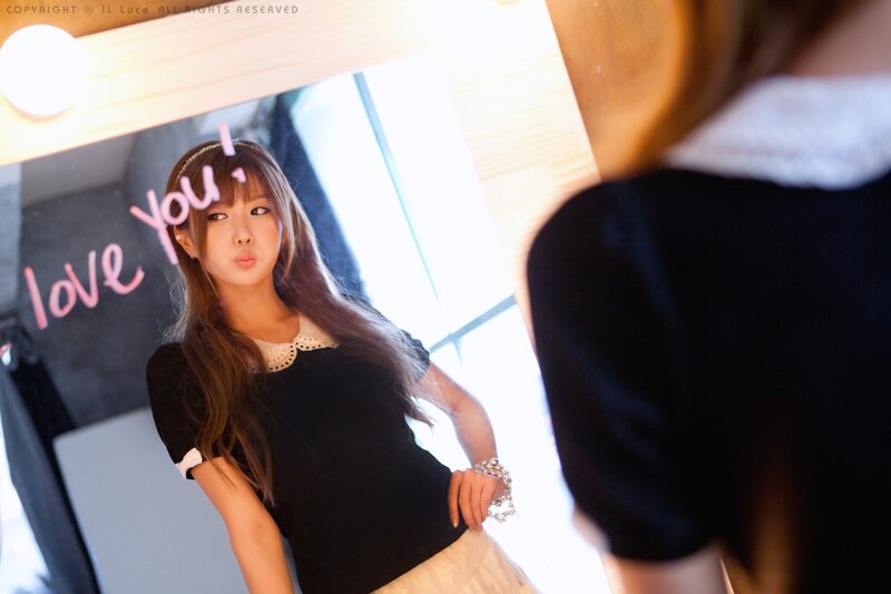 woman posing in front of mirror