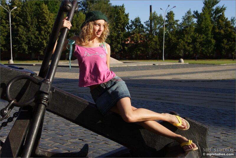 Woman posing on an anchor