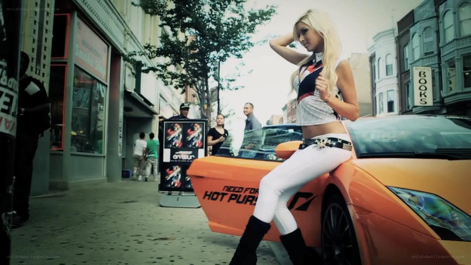 woman posing on orange car