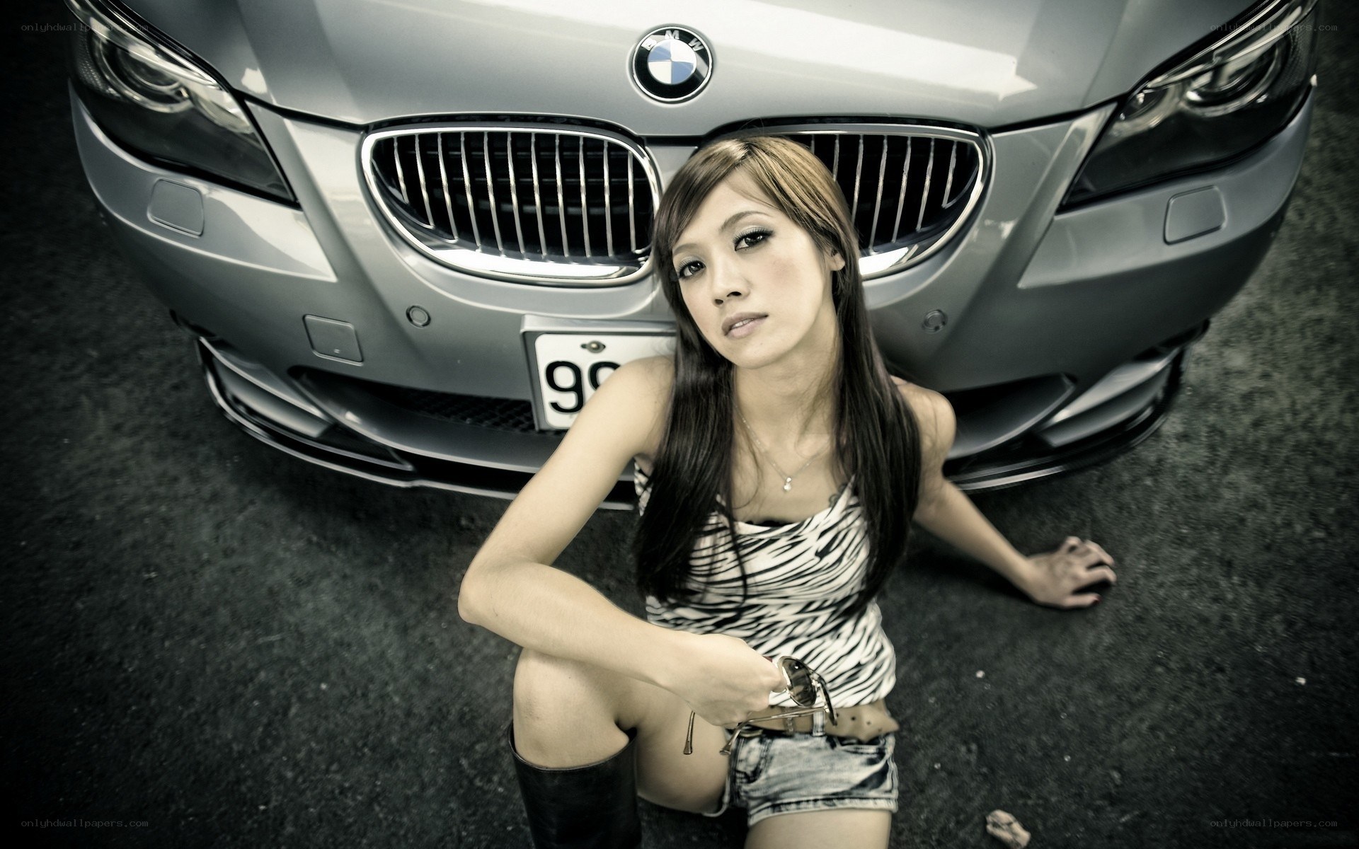woman posing with a car