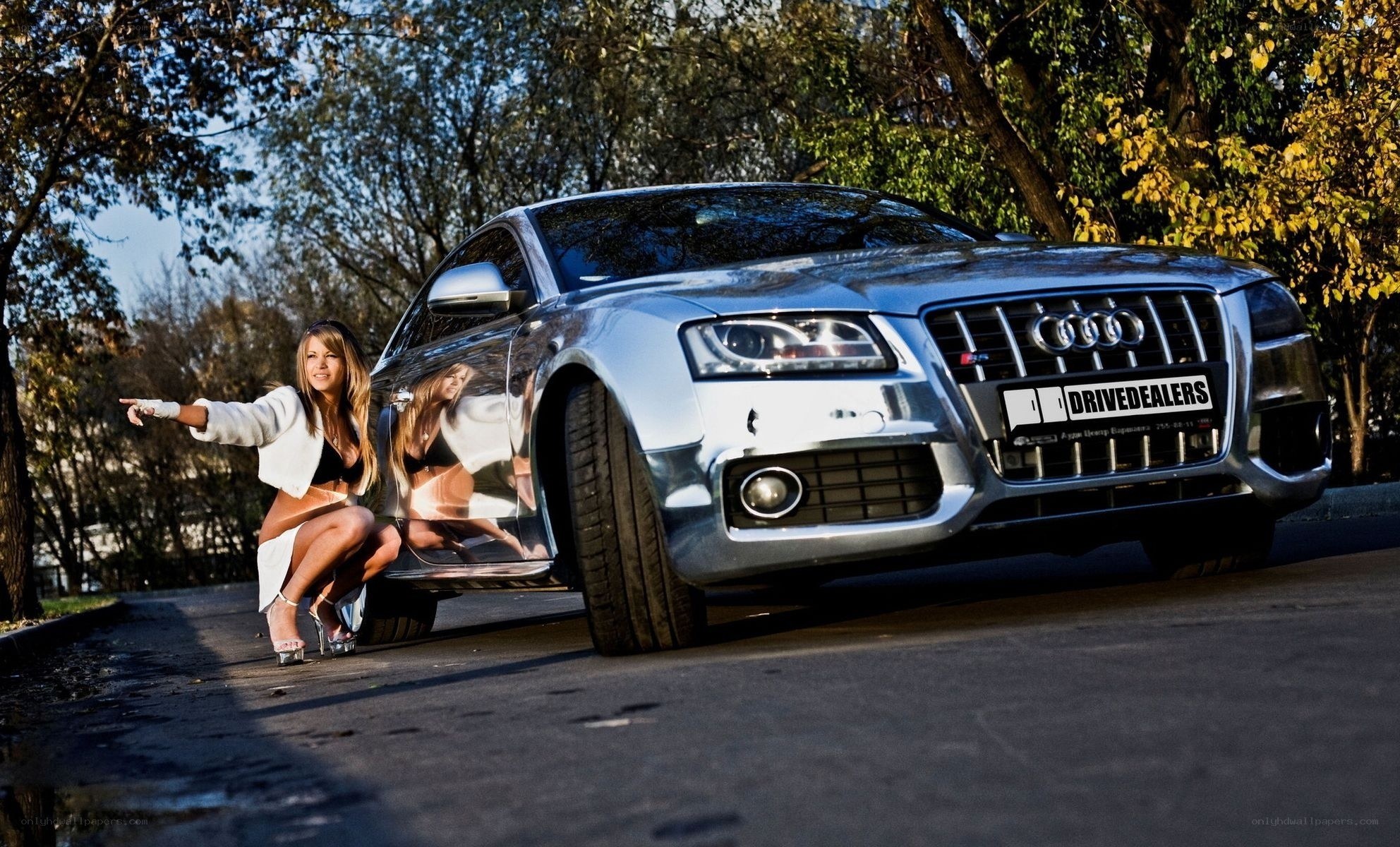 Woman posing with Audi car