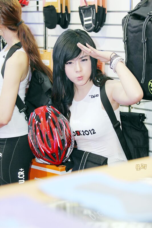 woman posing with bicycle helmet