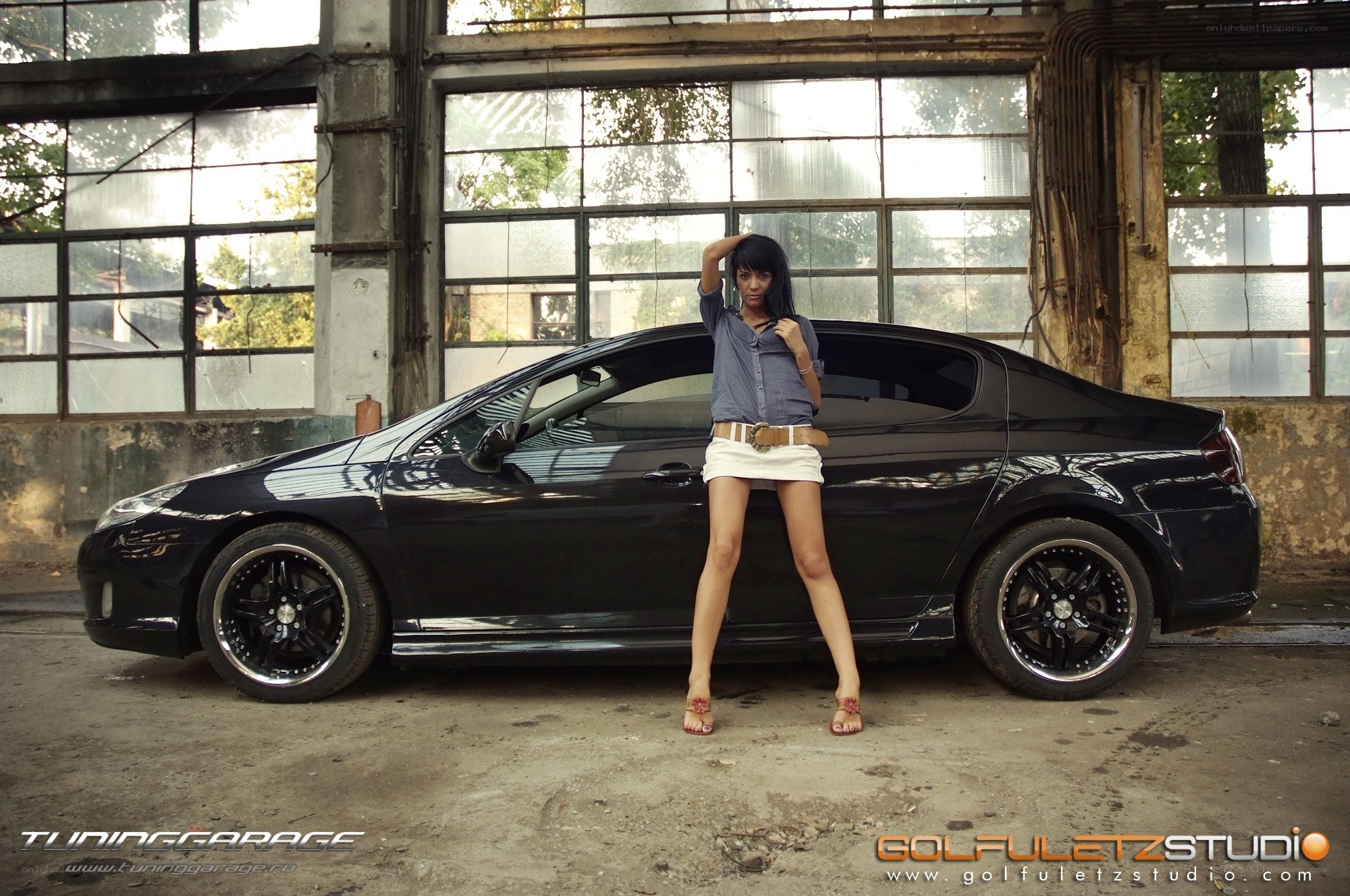 woman posing with black car
