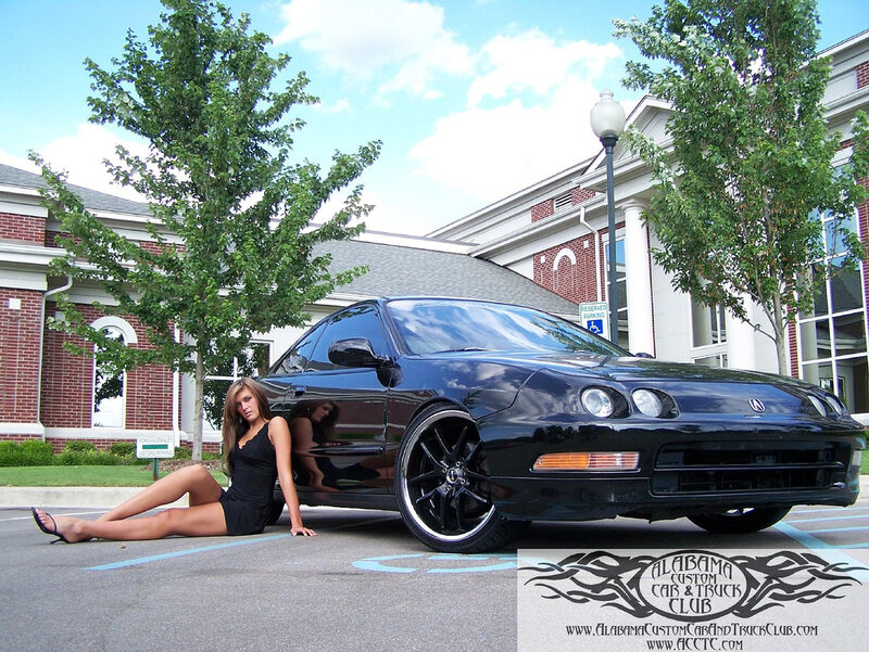 woman posing with black car