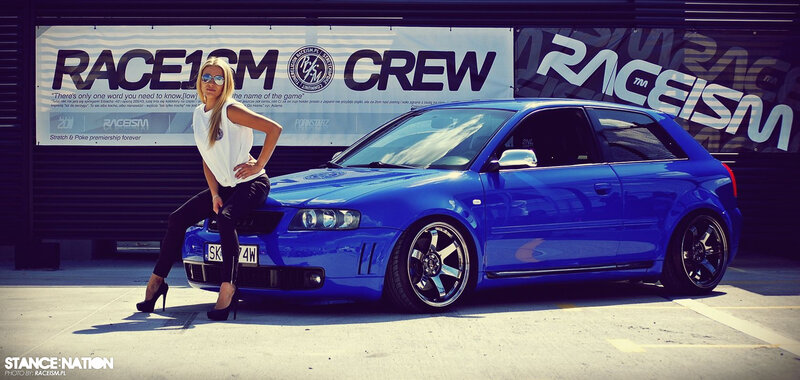 Woman Posing with Blue Car — Dramatic