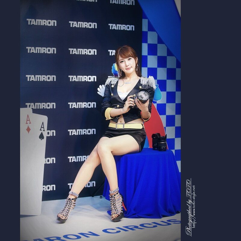 woman posing with camera