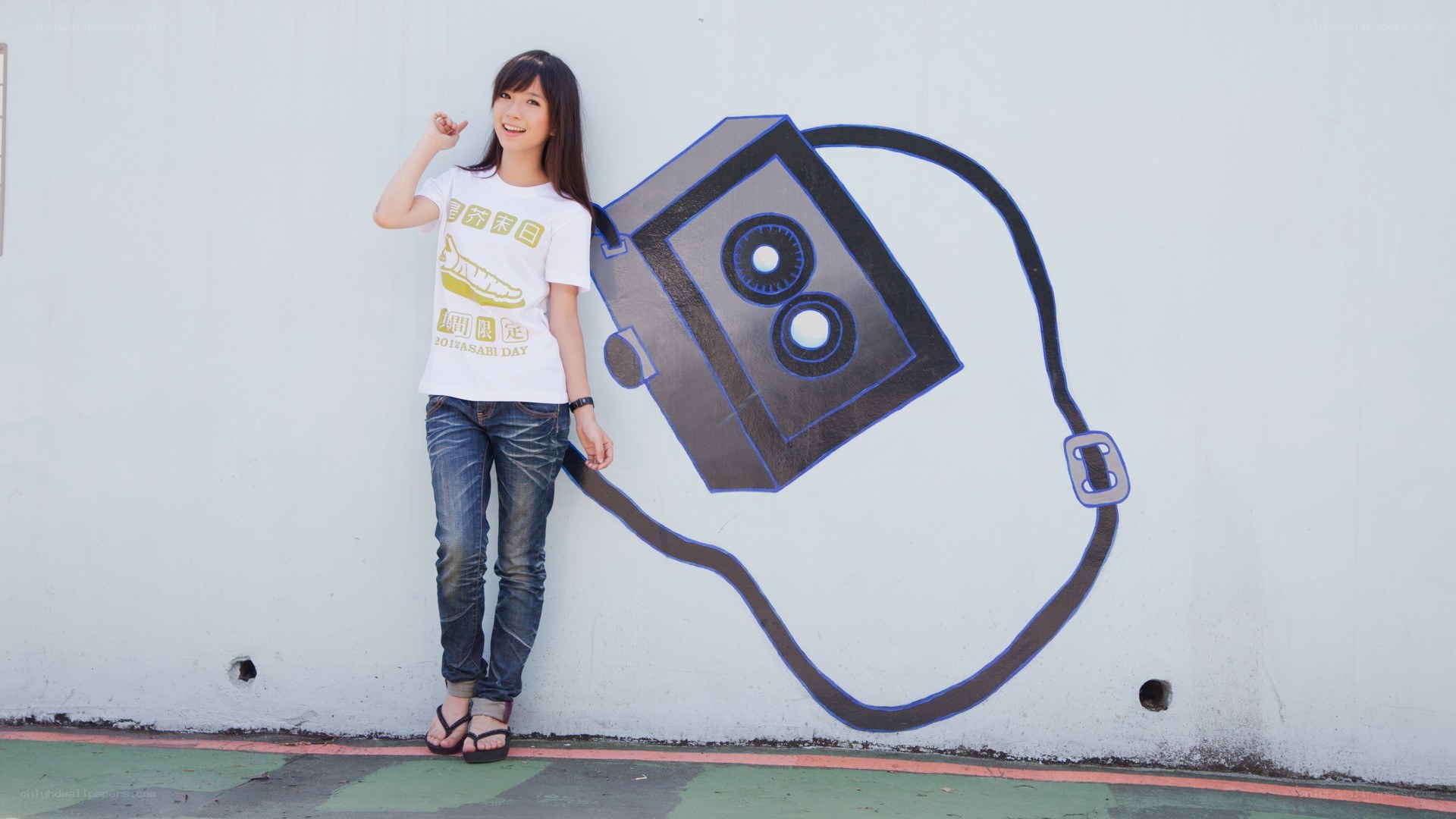 Woman posing with camera mural