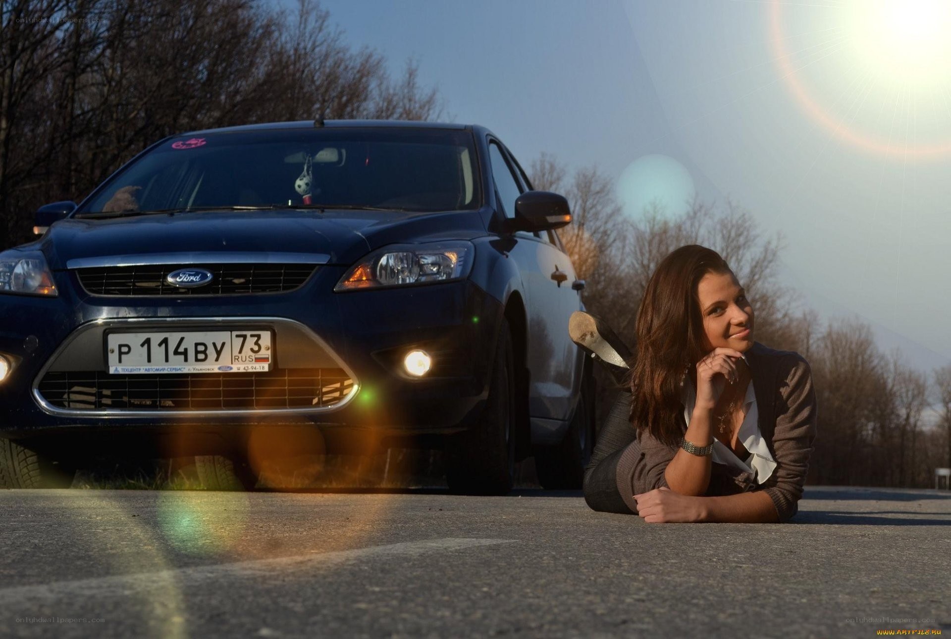 Woman posing with car