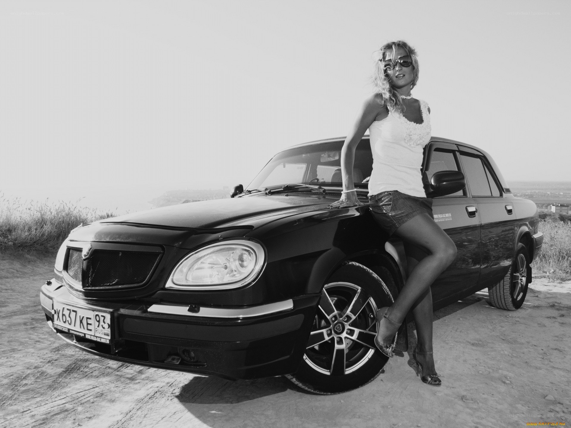 woman posing with car