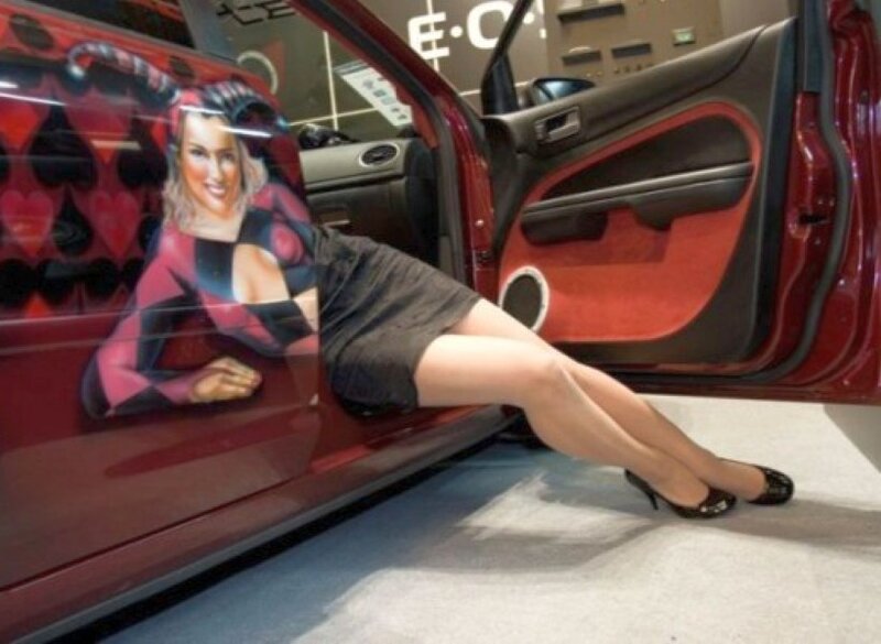 woman posing with car