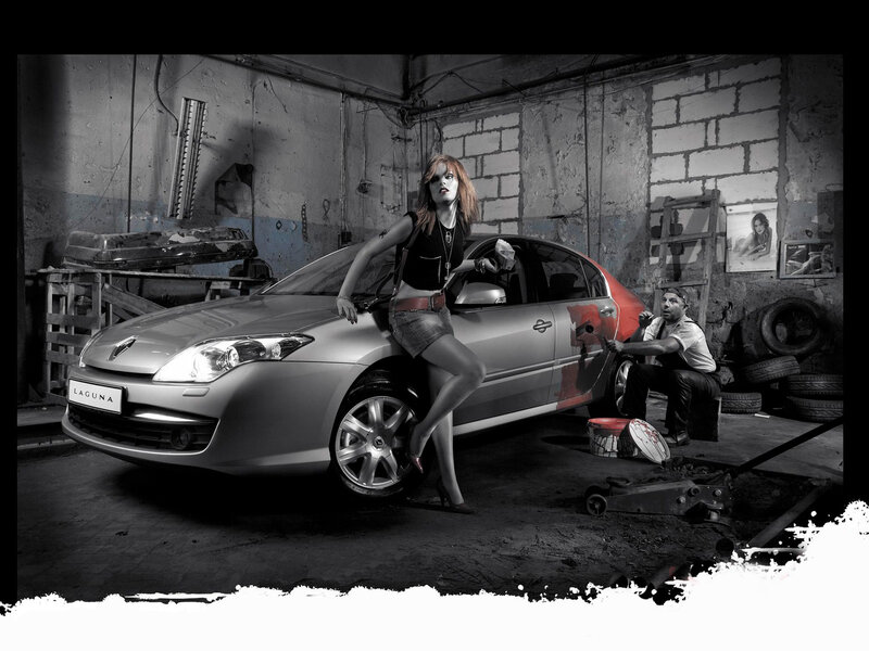 Woman posing with car in garage