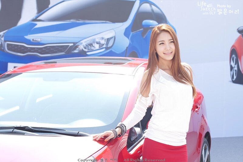 Woman Posing with Car — Red, Neutral, Afternoon