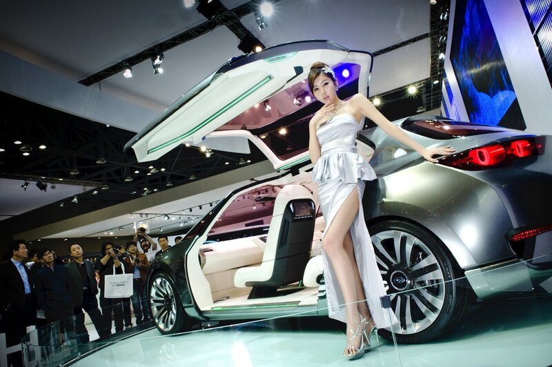 Woman Posing with Car — Silver, Showroom