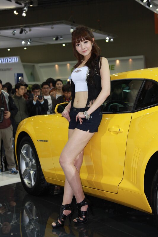 Woman Posing with Car — Yellow, Neutral, Photograph