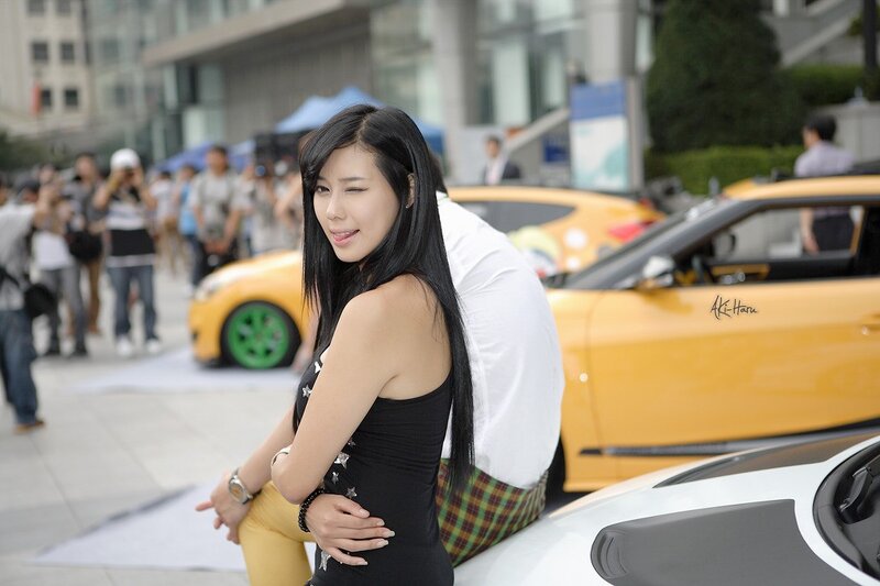Woman Posing with Cars — Yellow, Outdoor