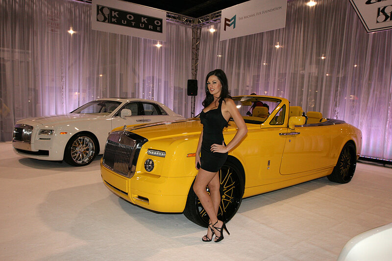 Woman Posing with Cars — Yellow