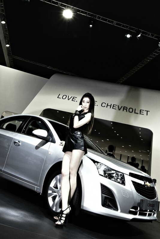 Woman posing with Chevrolet Cruze