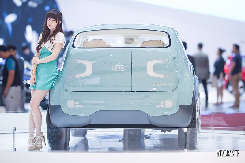 Woman posing with concept car