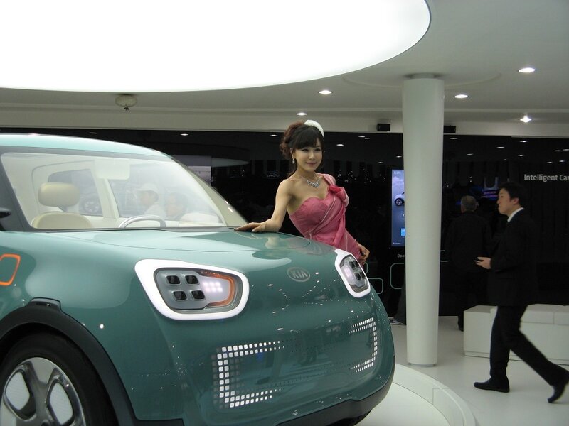 Woman posing with concept car