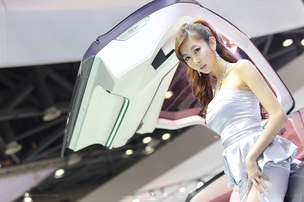 Woman posing with concept car