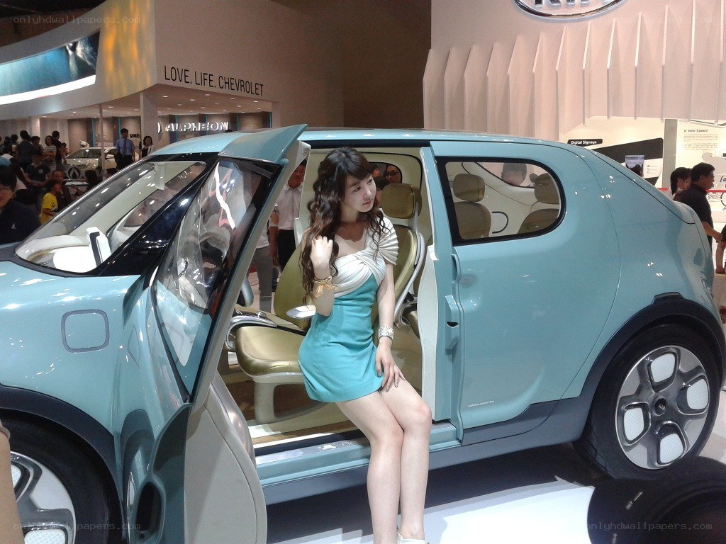 Woman posing with concept car
