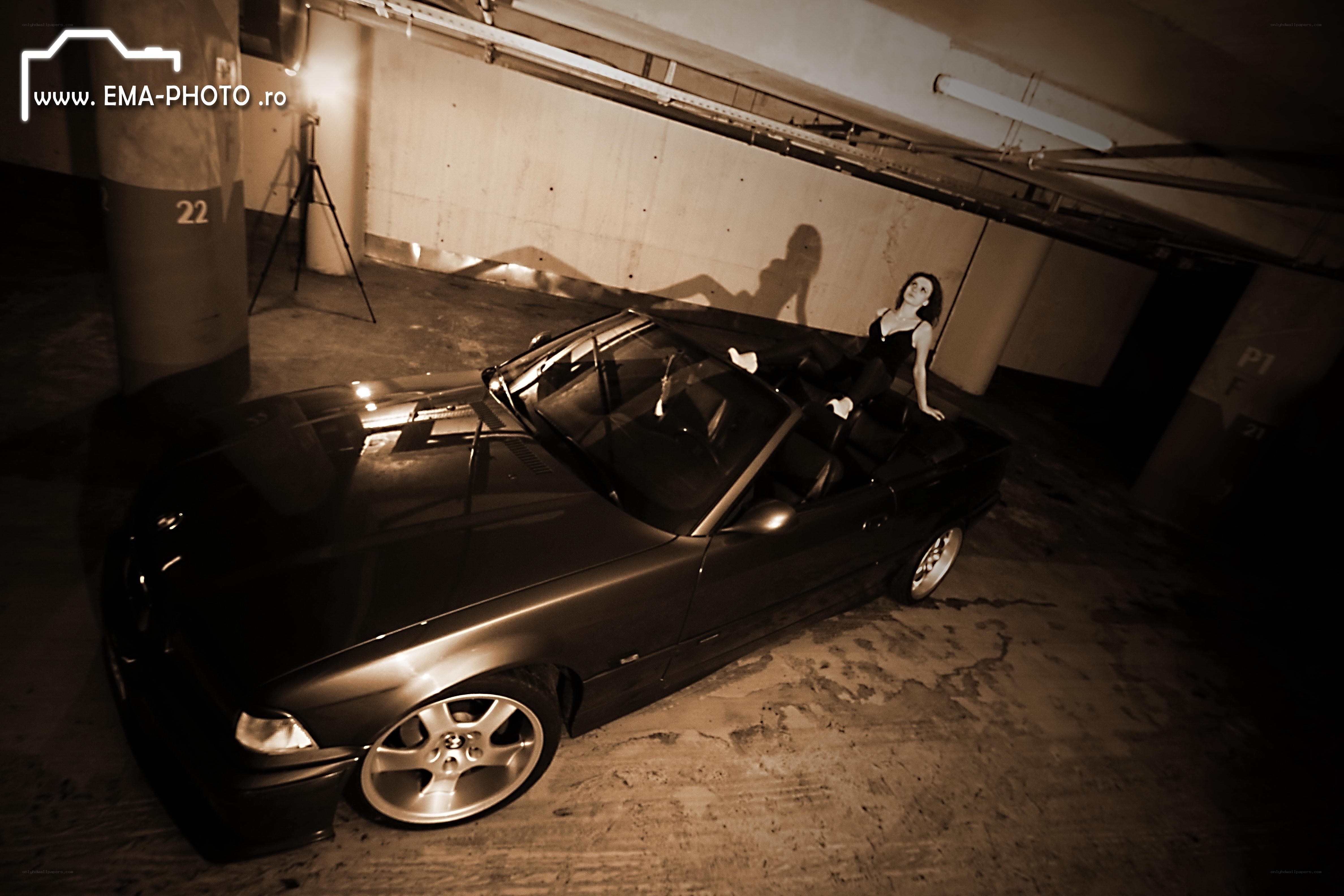 Woman posing with convertible car