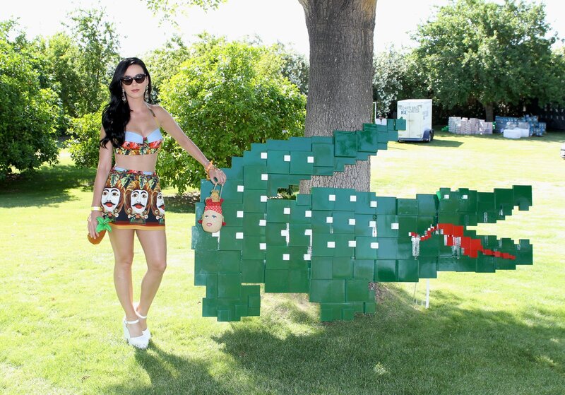 Woman posing with crocodile sculpture