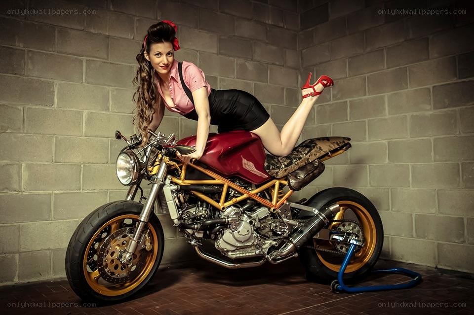 Woman posing with custom motorcycle