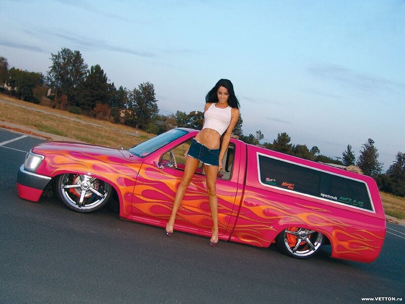 woman posing with custom truck