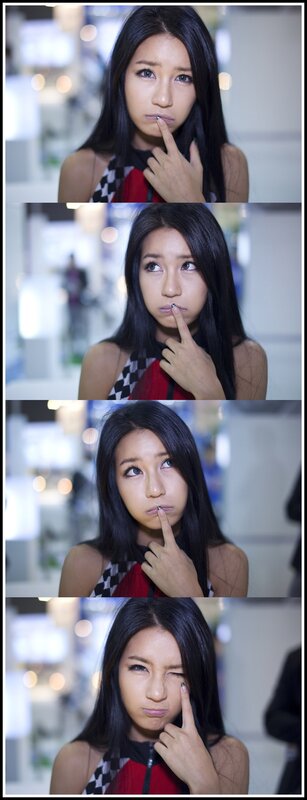 woman posing with finger to lip