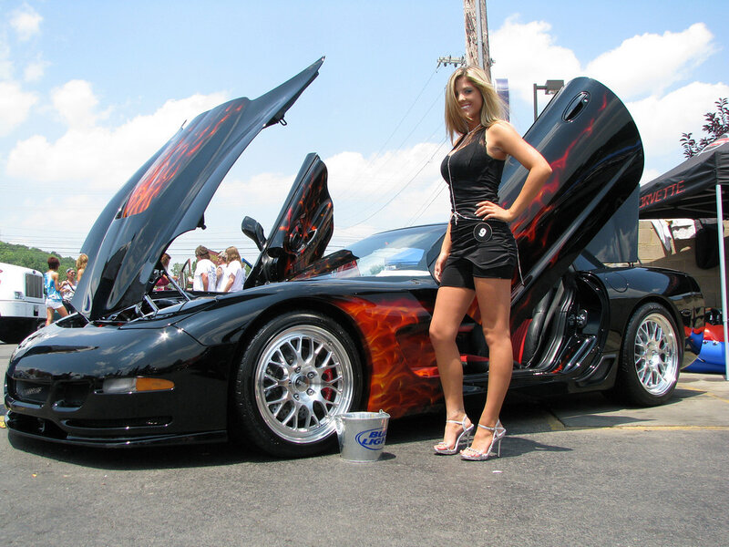 woman posing with flame car