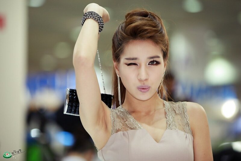 woman posing with hand raised