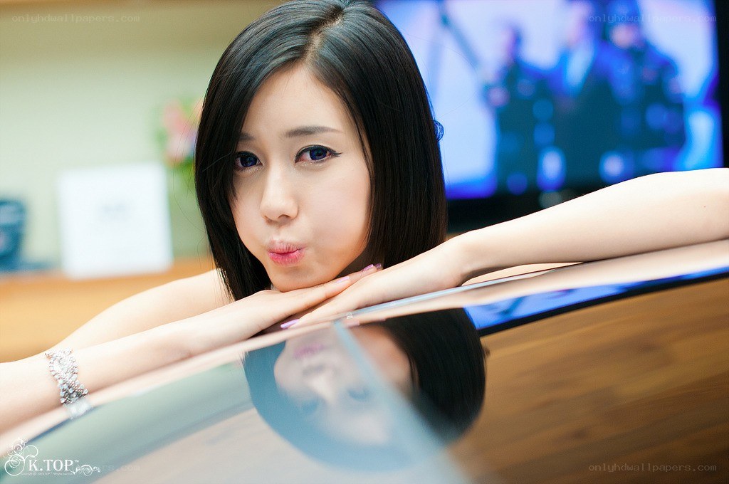 woman posing with laptop