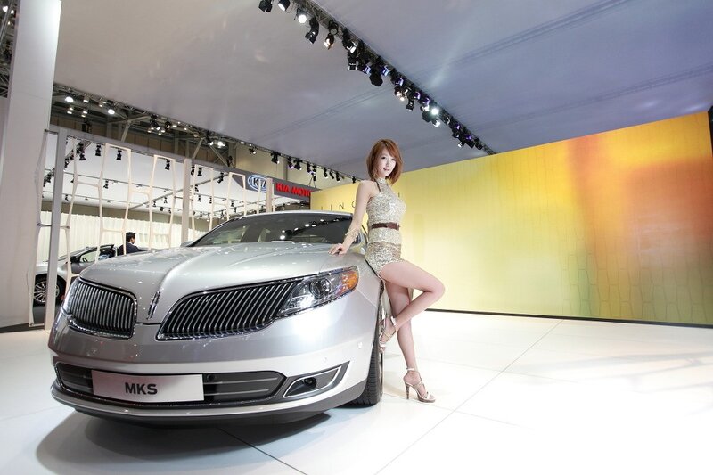 Woman posing with Lincoln MKS